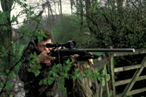 Shot Prints: Hunting, man using 222. 50 rifle
