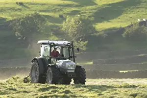 Agriculture Prints: Hurlimann tractor with tedder, turning grass in upland hay meadow