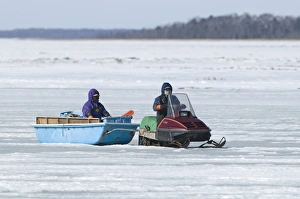 Japan Prints: Ice fishermen with skidoo on frozen lake, Lake Fuhren, Hokkaido, Japan, winter