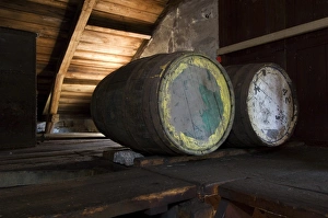 Industry Prints: Interior of historic oil refinery with oil barrels