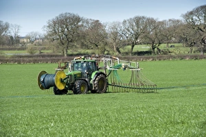 John Deere tractor with umbilical slurry spreader, spreading slurry into pasture, Winmarleigh, Lancashire, England