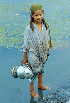 Sub Continent Prints: Kashmiri girl, standing in water holding vessel, Dal Lake, Srinagar, Kashmir, India
