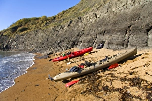 Canoe Prints: Kayaks with fishing rods, pulled up on beach, Chapmans Pool, Dorset, England, november
