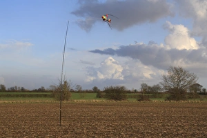 Pests Prints: Kite birdscarer on pole, in cultivated arable field, Bacton, Suffolk, England, february