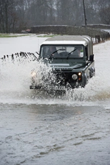 Flood Prints: Land Rover driving through flooded road, Cumbria, England, December
