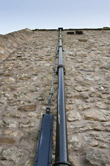 Drain Prints: Lightning conductor beside drain pipe on church tower