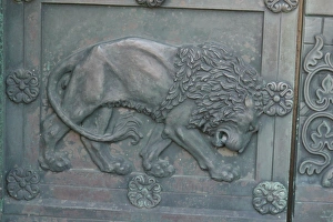 Sculptures Prints: Lion detail of bronze cathedral door in historic town