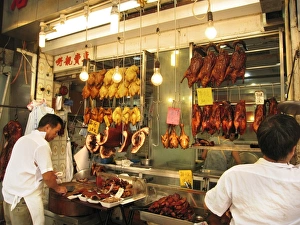 Meat Prints: Man preparing meat and poultry at cafe, Kowloon, Hong Kong, China