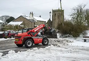 Teleporter Prints: Manitou MLT 523 telehandler clearing snow from road in village