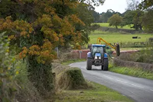 Hedges Prints: Mechanised hedge cutting, tractor with flail cutting hedgerow beside road