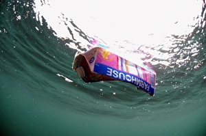Drifting Prints: Milk carton floating in sea, Kimmeridge Bay, Isle of Purbeck, Dorset, England, august