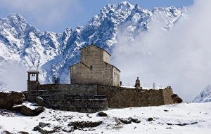Monasteries Prints: Monastery in village with snow covered mountains