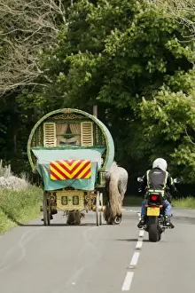 Transports Prints: Motorcyclist overtaking horse drawn traveller caravan on rural road