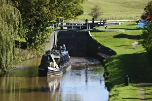 Locks Prints: Narrowboat leaving canal lock, built from iron because of sandy soil conditions