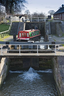 Narrowboat moving through canal staircase lock, Bunbury Locks, Shropshire Union Canal, Bunbury, Cheshire, England