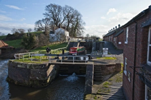 Narrowboat moving through canal staircase lock, Bunbury Locks, Shropshire Union Canal, Bunbury, Cheshire, England
