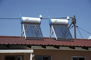 Rooftop Prints: New housing with solar water heating on roof