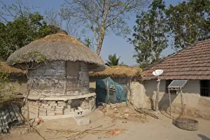 West Bengal Prints: Old-fashioned grain store with modern satellite dish and solar panel