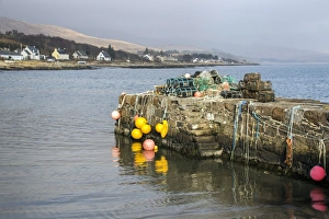 Stone Prints: The old stone jetty at Craighouse with lobster pots and floats