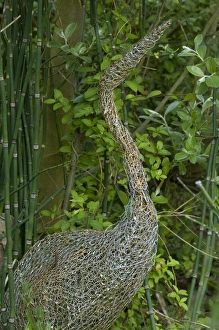 Sculptures Prints: Ornamental wire mesh heron in garden, Norfolk, England, april