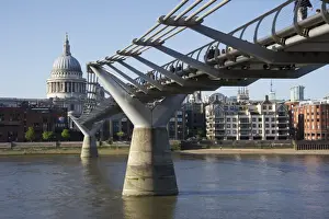 Bridges Prints: Pedestrians crossing river on steel suspension footbridge