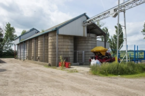 Hogs Prints: Pig farming, feed storage bins on pig farm, Driffield, East Yorkshire, England, June