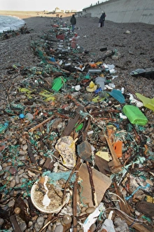 Pollution Prints: Plastic rubbish washed up on beach strandline, Chesil Beach, Dorset, England, January