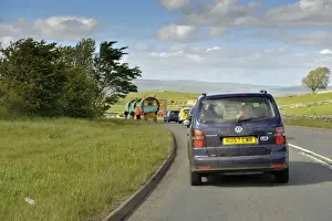 Cars Prints: Queue of traffic behind horse drawn Gypsy caravans on road to Appleby Fair