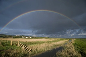 Rain Bow Prints: Rainbow over coastal grazing marsh habitat, Salthouse, North Norfolk, England, may