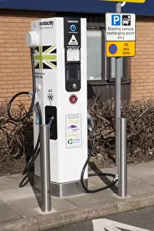 Cars Prints: Recharging point for electric cars at motorway service area, England, April
