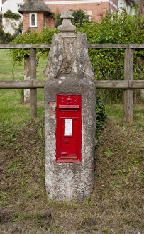 Post Prints: Red postbox mounted on post in village, Aylesbeare, Devon, England, may