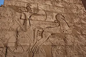 Carving Prints: Relief showing Ramesses II on chariot slaying enemies
