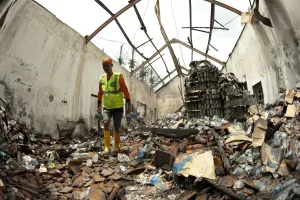 Supply Prints: Rescue worker walking around abandoned water supplies