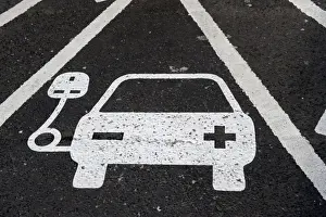 Cars Prints: Reserved parking bay at recharging point for electric cars at motorway service area