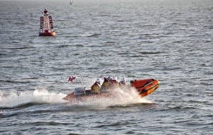 Lifeboats Prints: RNLI D-class inflatable lifeboat in harbour entrance