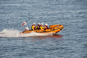 RNLI D-class inflatable lifeboat in harbour entrance, Dublin Port, Dublin Bay, Ireland, november