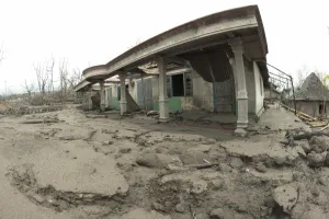 Javan Prints: Road covered in ash, dead trees and damaged houses
