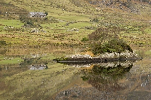 County Prints: Rocks and building reflected in lake