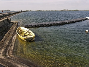 Reservoirs Prints: Rowing boat at edge of manmade reservoir