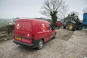 Jobs Prints: Royal Mail van and postman, delivering post to farm, Preston, Lancashire, England, March