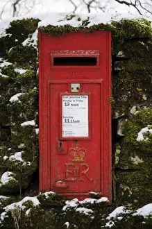 Countryside Prints: Royal Mail wall box postbox in moss covered wall with snow