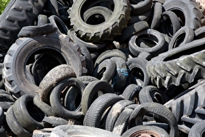 Clamp Prints: Rubber tyres used to hold sheeting down on silage clamp, England, june