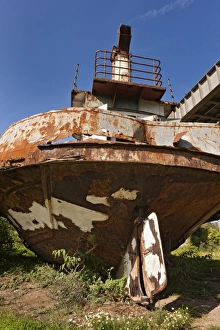 Rusty Prints: Rusting hulk of old ferry boat on bank of river