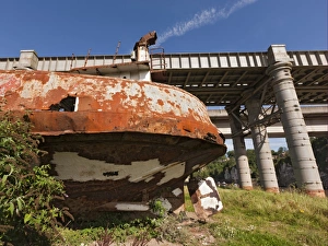 Rusting hulk of old ferry boat on bank of river, Chepstow, River Wye, Wye Valley, Monmouthshire, Wales, august