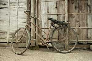 Transports Prints: Rusty old bike leaning against wooden fence, Cepu, Java, Indonesia