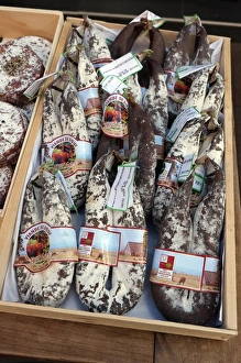 Sells Prints: Salers beef sausages on food market stall