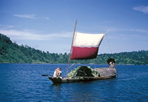 sampan transport boat in Bangladesh moving bananas, taken in the 1960s by Eric Hosking when the country was known as