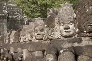 Sculptures Prints: Sculptures of Asuras (demonic monsters) at gate tower of Khmer temple