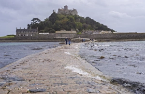 Pathway Prints: Seawater covering manmade causeway to tidal island