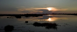 Twilight Prints: Setting sun over Monachena River near Kwara, Okavango Delta, Botswana